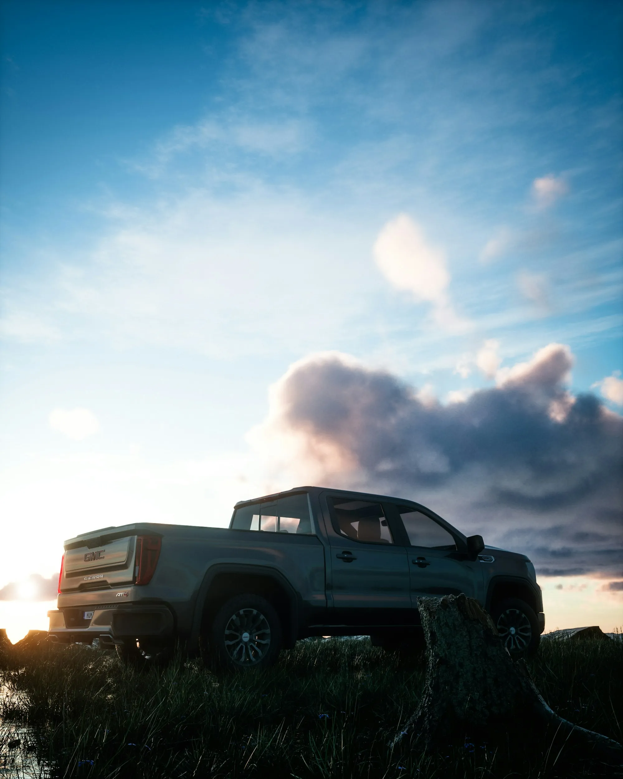 Pickup truck parked on a hilltop under a big sky